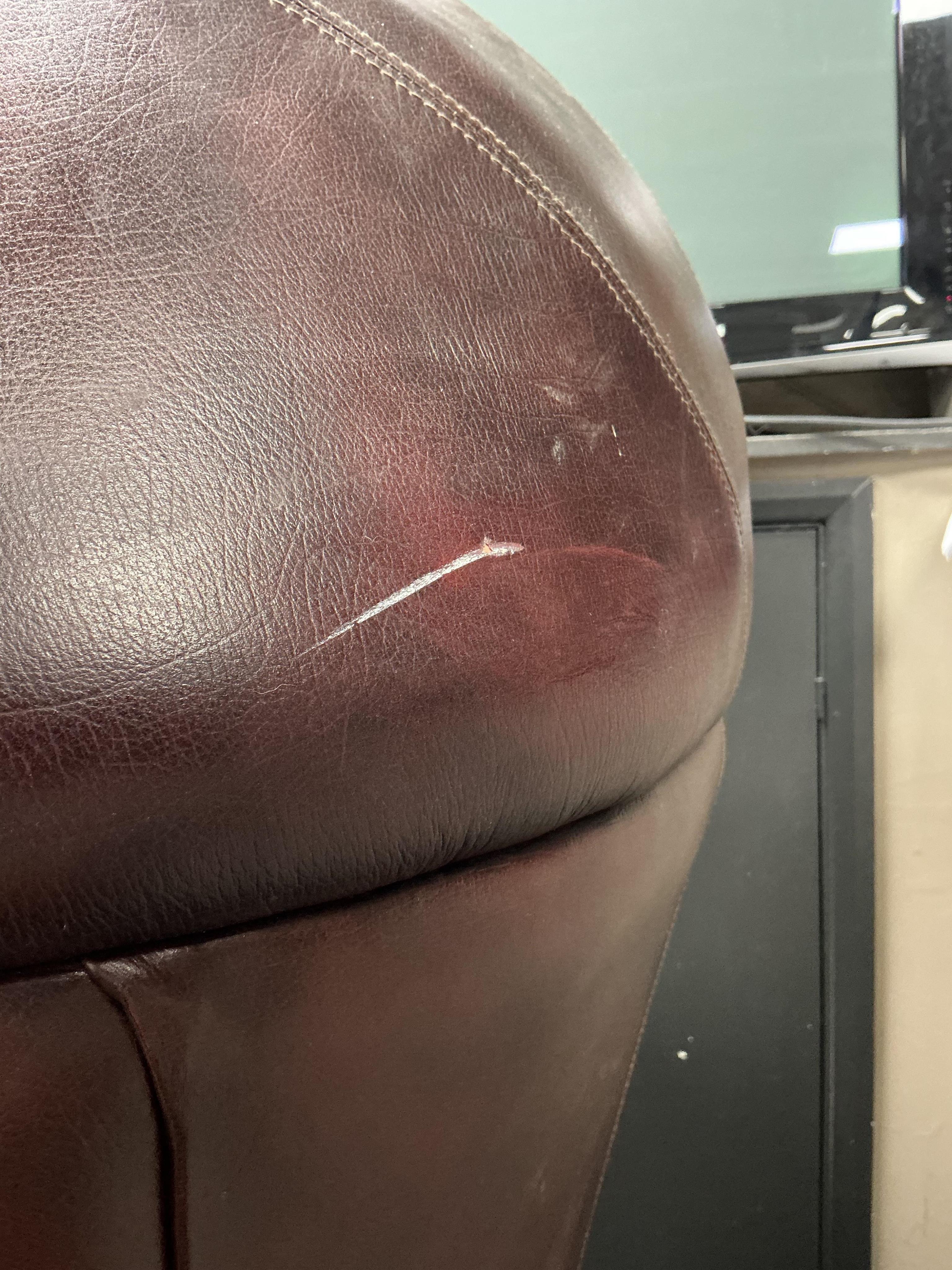 A reproduction buttoned burgundy leather hall porter's chair, width 88cm, depth 64cm, height 176cm